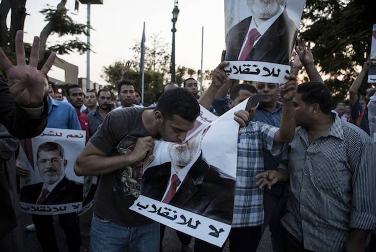 Supporters of deposed Egyptian President Mohammed Morsi gather on the Nile River corniche in the Maadi district to protest the recent killing of protesters by Egyptian Security Forces, on August 18, 2013 in Cairo, Egypt.(Getty)