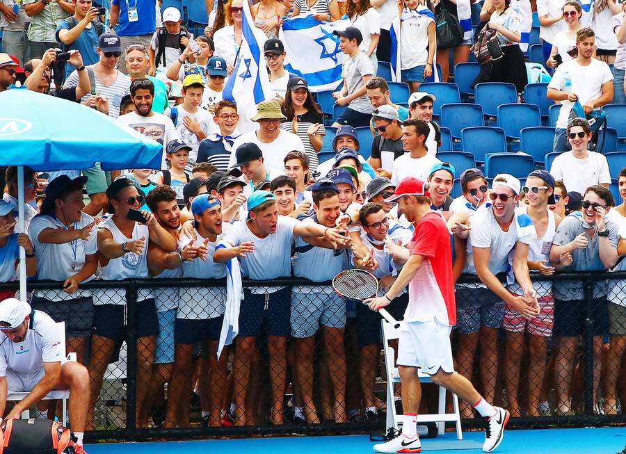 Dudi Sela celebrates with his fans after defeating Benjamin Becker from Germany in the first round of the 2016 Australian Open