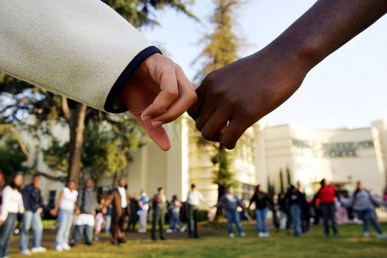 Students pray in the aftermath of two apparent racially motivated student brawls at Thomas Jefferson High School in Los Angeles, April 21, 2005