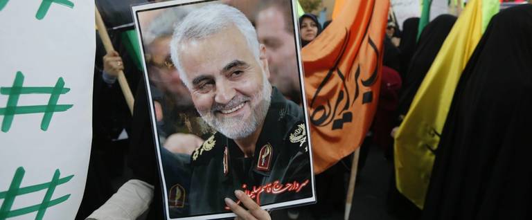 Iranian protesters hold a portrait of the commander of the Iranian Revolutionary Guard Corps' Quds force, Gen. Qassem Soleimani, during a demonstration in the capital Tehran on Dec. 11, 2017