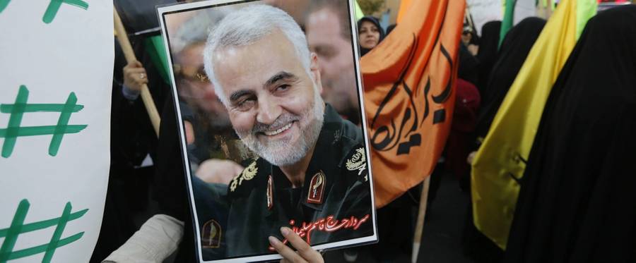 Iranian protesters hold a portrait of the commander of the Iranian Revolutionary Guard Corps' Quds force, Gen. Qassem Soleimani, during a demonstration in the capital Tehran on Dec. 11, 2017