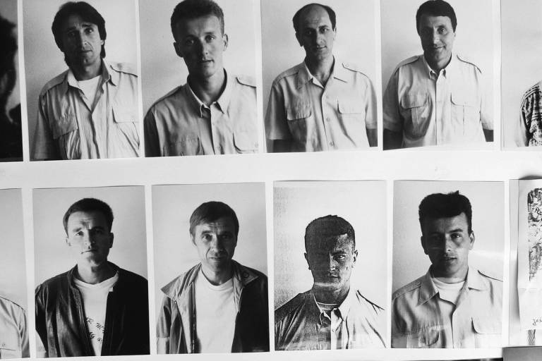 Photographs of missing men from Srebrenica displayed in the office of the Srebrenica Widow's Association in Tuzla, Bosnia and Herzegovina, 2002