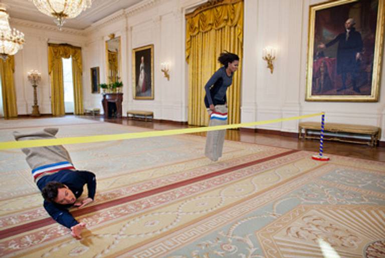 Michelle Obama and Jimmy Fallon hold a potato sack race at the White House.(White House/Flickr)