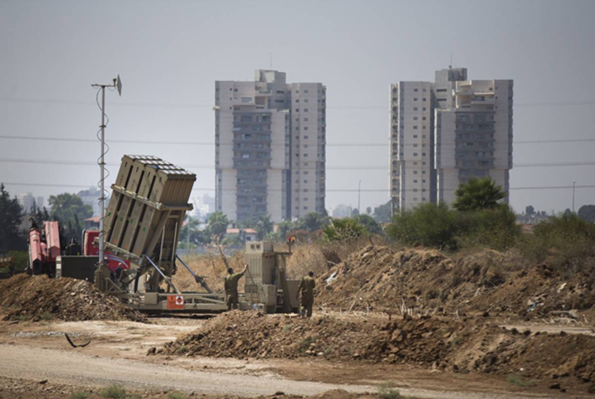  Israeli soldiers work on the 'Iron Dome' missile defense system on August 30, 2013 in Tel Aviv, Israel. (Uriel Sinai/Getty Images)