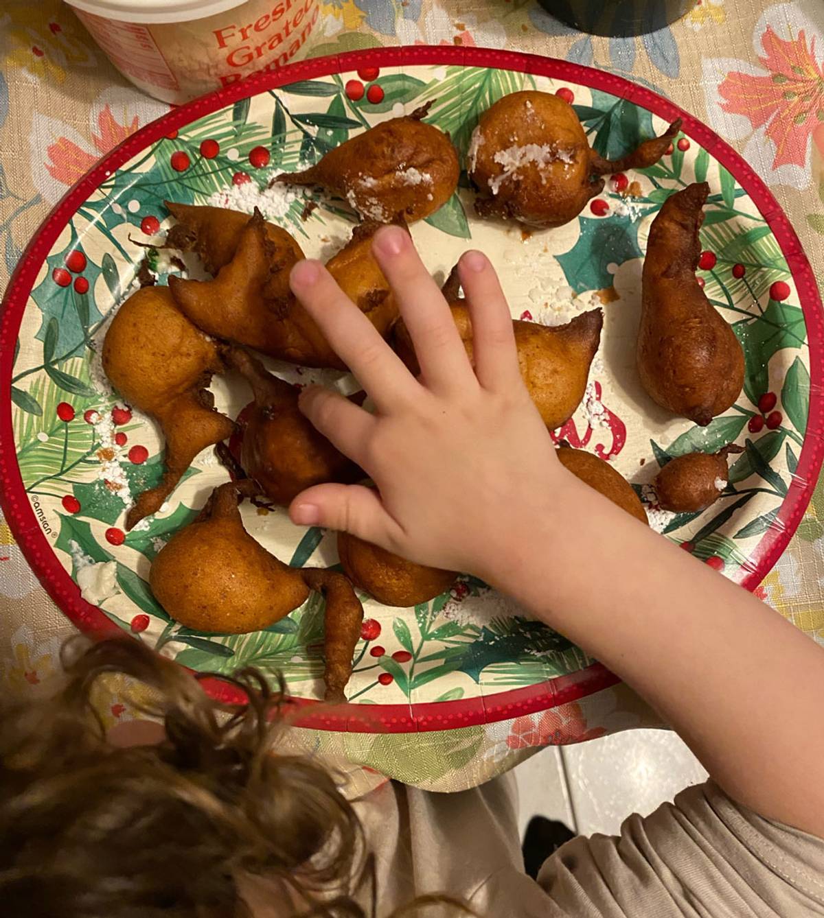 One of Allison's children sampling the sfingi