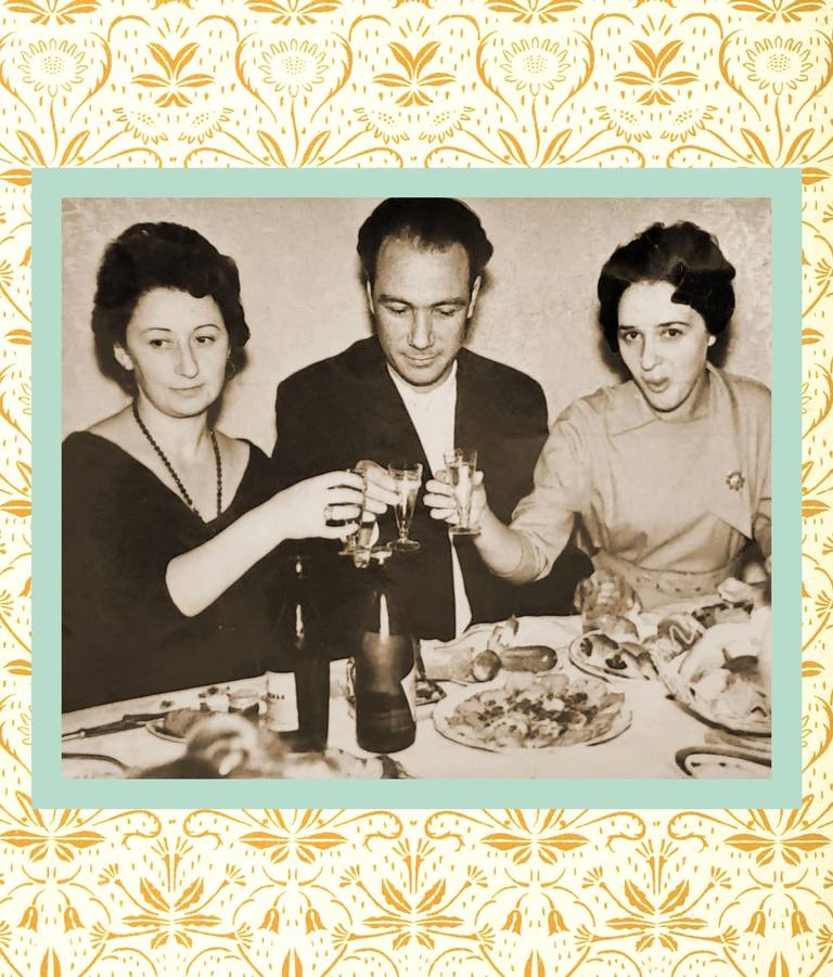 The author's grandparents, at left, at a dinner party in Ukraine