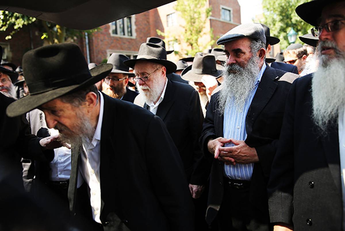 Mourners pay their respects outside the Chabad-Lubavitch headquarters during the funeral of Rabbi Joseph Raksin on August 11, 2014 in Brooklyn, N.Y. (Spencer Platt/Getty Images)