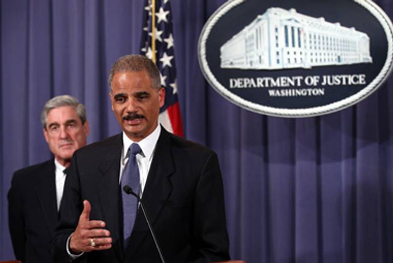 Attorney General Eric Holder, flanked by FBI Director Robert Mueller, announcing the alleged plot yesterday.(Win McNamee/Getty Images)