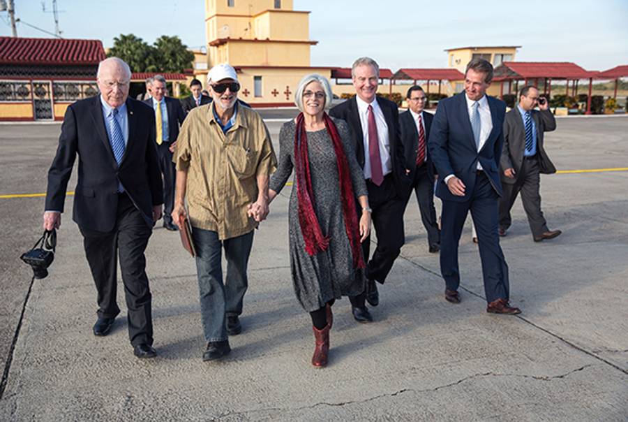 U.S. contractor Alan Gross with his wife, Judy Gross, attorney Scott Gilbert, Sen. Jeff Flake, (R-AZ), Sen. Patrick Leahy, (D-VT) and Rep. Chris Van Hollen, (D-MD) on December 17, 2014, during his release from prison after being held in Cuba since 2009. (Lawrence Jackson/The White House via Getty Images)