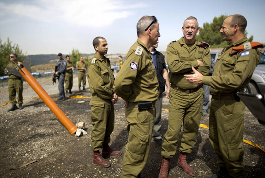 Israeli army Chief of Staff Benny Gantz (2nd R) talks to officers as he surveys a drill simulating a chemical attack on May 29, 2013 in Jerusalem. (ABIR SULTAN/AFP/Getty Images)