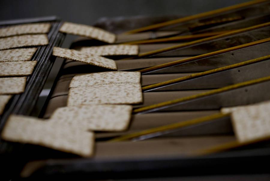 Hot matzos from the oven travel a serpentine cooling belt in the matzo production line at the Manischewitz manufacturing facility on February 4, 2014 in Newark, New Jersey. (Jeff Zelevansky/Getty Images)