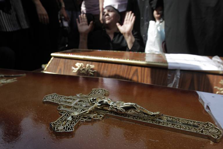 A Coptic Christian woman mourns yesterday in Cairo.(Mahmud Hams/AFP/Getty Images)