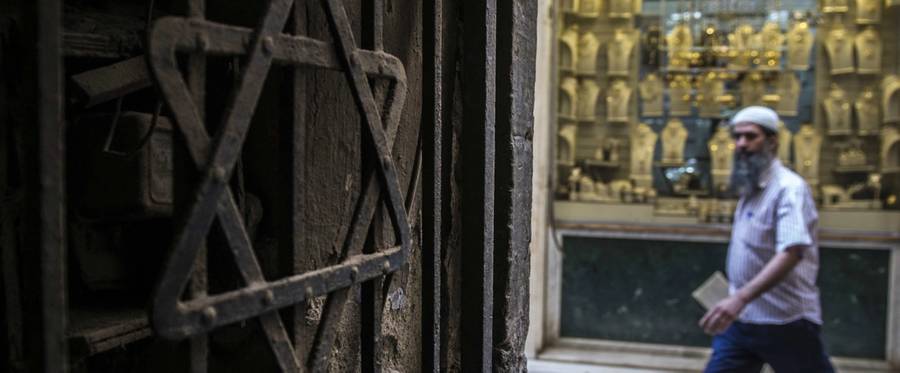 A man walks past a Star of David decorating the door of a home in the Jewish quarter of Cairo, Egypt, June 25, 2015. (Khaled Desouki/AFP/Getty Images)