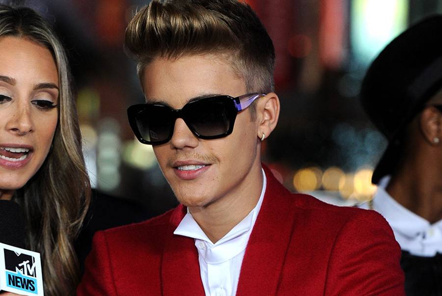 Singer/producer Justin Bieber arrives at the premiere of Open Road Films' "Justin Bieber's Believe" at Regal Cinemas L.A. Live on Dec. 18, 2013 in Los Angeles, Calif.(Kevin Winter/Getty Images)