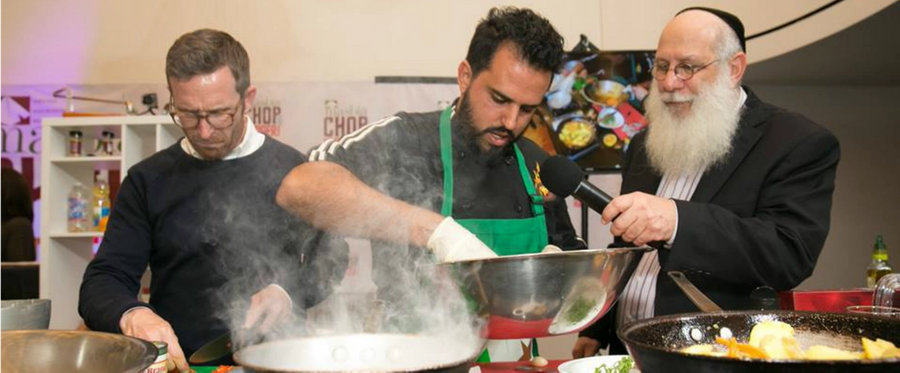 Asaf Hadad of Miami's Fuego restaurant whips up a batch of food during Masbia's 'Top Chef' fundraiser at Lincoln Center Synagogue, New York, New York, September 21, 2016. 