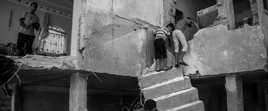 Detail, Palestinians retrieving belongings from the ruins of their house in Beit Hanoun, Gaza Strip, Aug. 12, 2014.