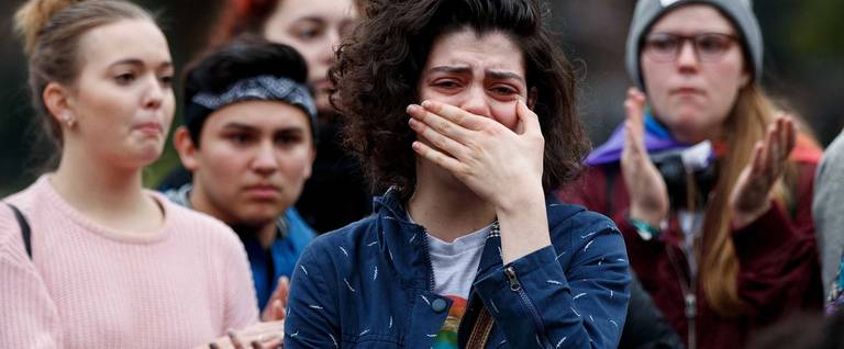 Natalie Meilen, a student at New York University, breaks down after speaking about her grievances with the policies of Donald Trump and Mike Pence during a gathering in Washington Square Park, November 9, 2016 in New York City.