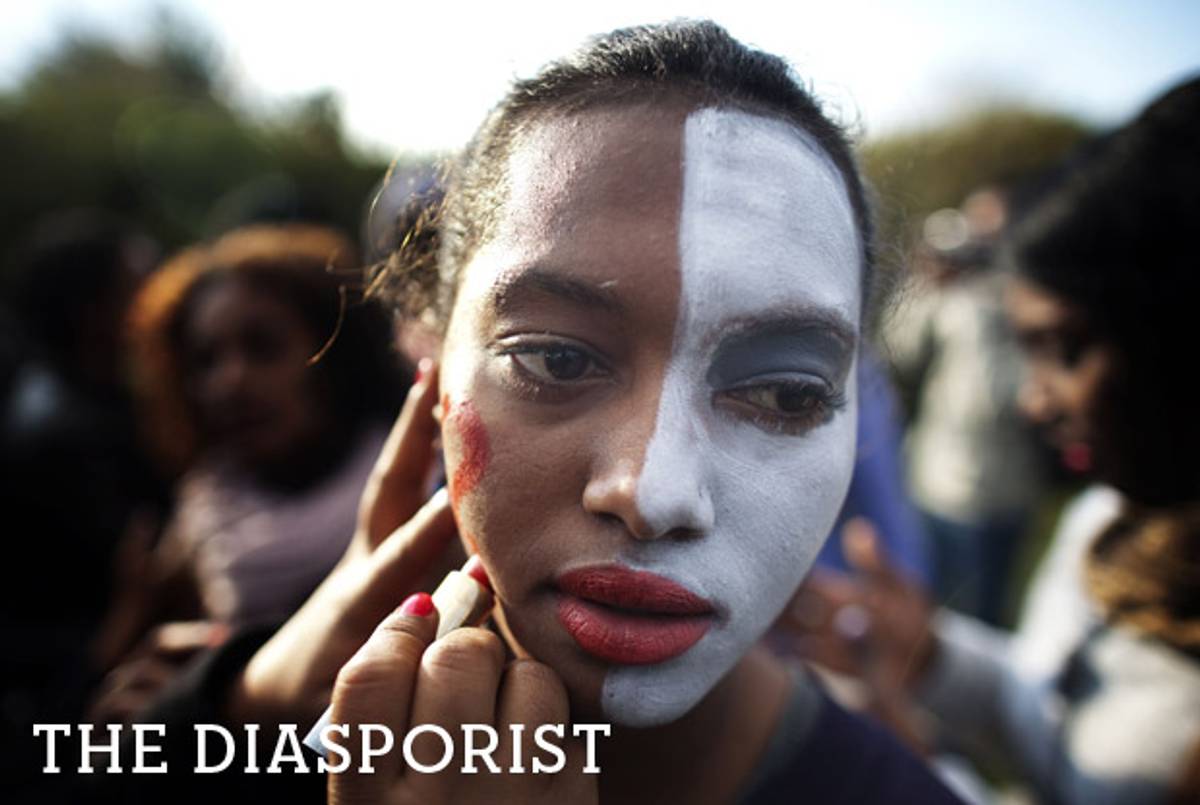 An Israeli Jew of Ethiopian origin has her face painted white during a protest against racism and discrimination, in front of the Knesset in Jerusalem, on Jan. 18, 2012.(Menahem Kahana/AFP/Getty Images)
