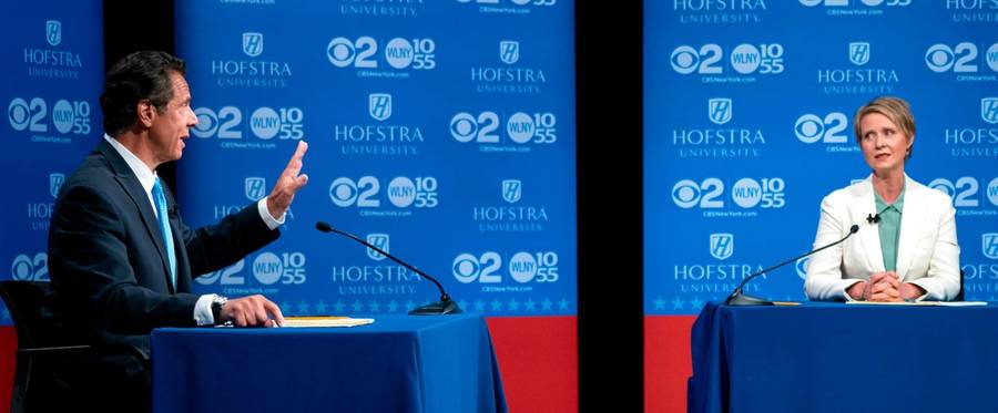 New York Gov. Andrew Cuomo answers a question as Democratic New York gubernatorial candidate Cynthia Nixon looks on during a gubernatorial debate at Hofstra University in Hempstead, New York, on Aug. 29, 2018.