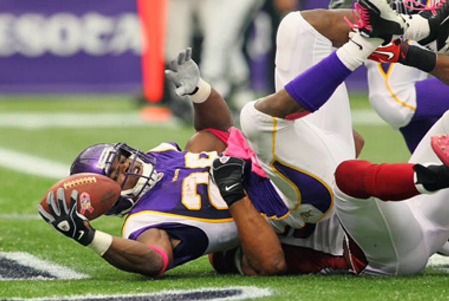 Adrian Peterson, rocking the pink.(Adam Bettcher /Getty Images)