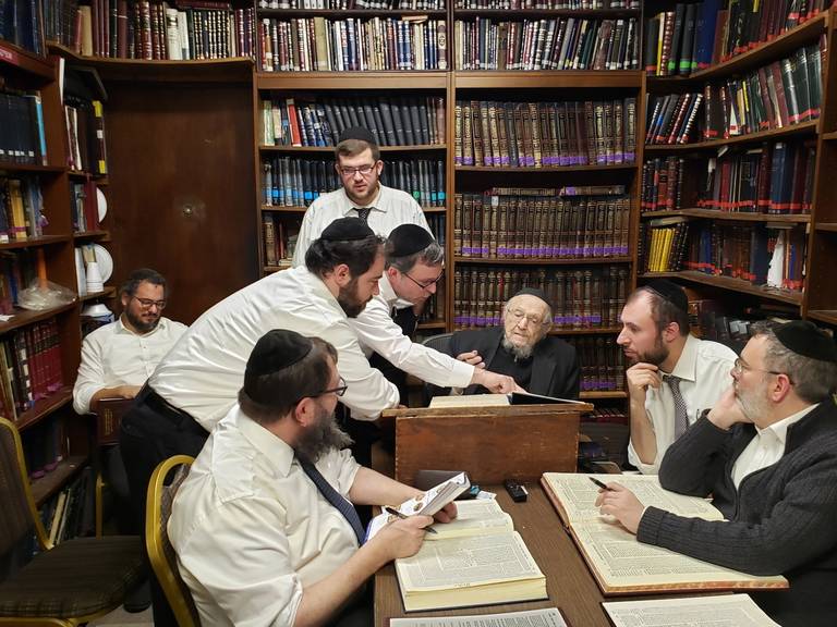 A scene from the author’s days studying at Mesivtha Tifereth Jerusalem (MTJ). The late Rav Dovid Feinstein sits at the head of the table.