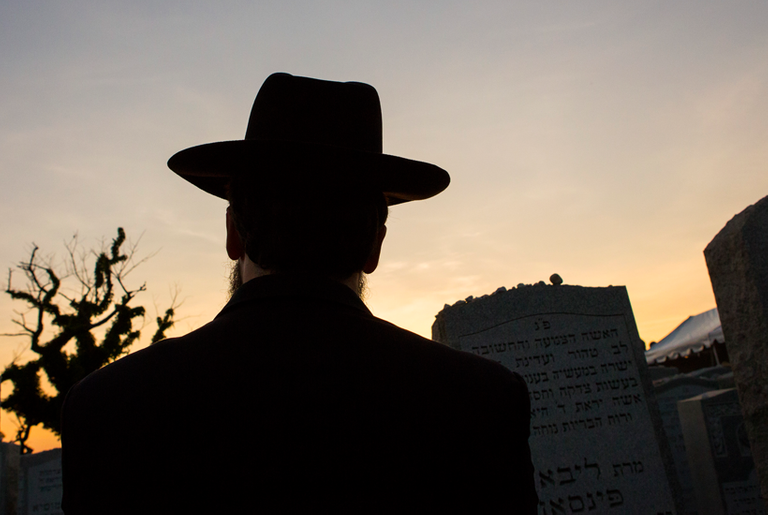 At the gravesite of the Lubavitcher Rebbe, Rabbi Menachem Mendel Schneerson, June 30, 2014 at the Old Montefiore Cemetery, Queens, New York. This year marks the 20th anniversary of the Rebbe's passing.(Photo by Eric Thayer/Getty Images)