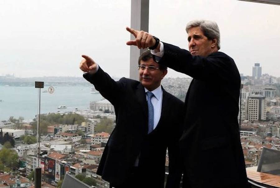 Turkish Foreign Minister Ahmet Davutoglu shows U.S. Secretary of State John F. Kerry the skyline of Istanbul before the start of a meeting in the Turkish city.((Hakan Goktepe / AFP/Getty Images))
