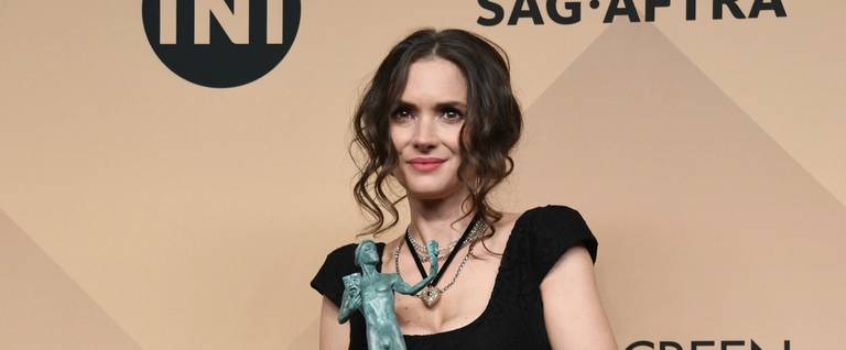 ctor Winona Ryder, co-recipient of the Outstanding Performance by an Ensemble in a Drama Series award for 'Stranger Things,' poses in the press room during the 23rd Annual Screen Actors Guild Awards at The Shrine Expo Hall in Los Angeles, California, January 29, 2017. 