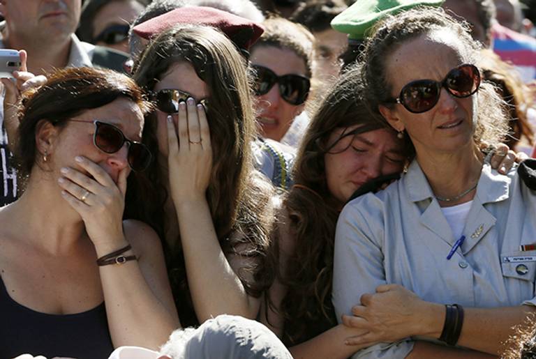 Relatives and friends of slain 36-year-old Israeli reservist Sergeant First Class (res.) Yair Ashkenazi, who was killed in the northern Gaza Strip, mourn during his funeral on July 25, 2014 in the southern Israeli city of Rehovot. ( GALI TIBBON/AFP/Getty Images)