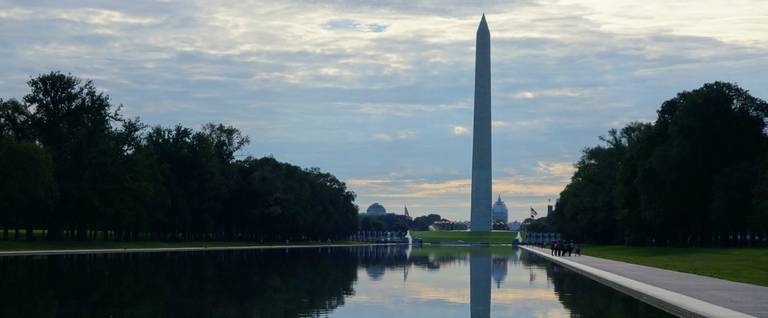 The Washington Monument and US Capitol are seen beyond the waters of the reflecting pool on the National Mall in Washington, DC on August 8, 2015. 