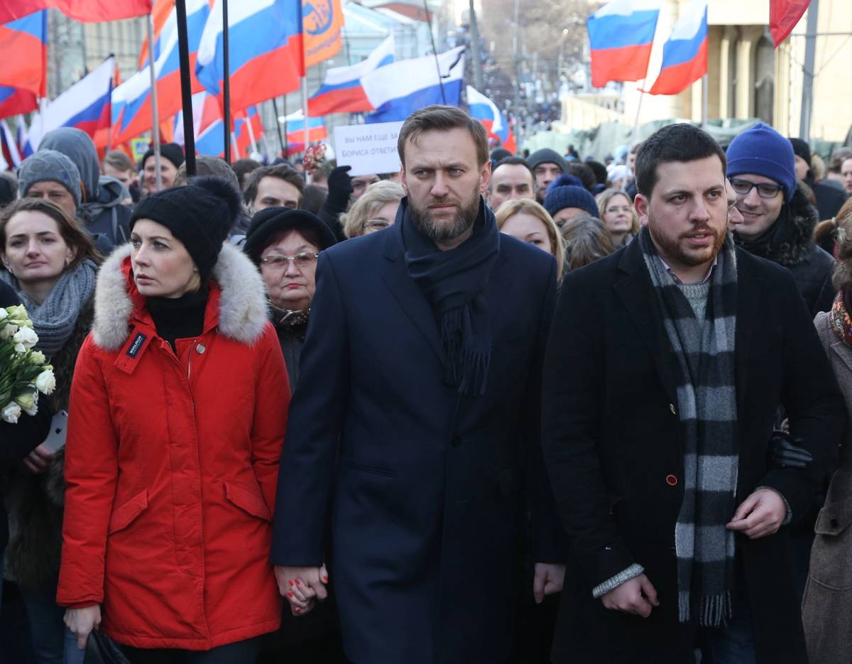  Alexei Navalny, at center, his wife Yulia Navalnaya, left, and Leonid Volkov, right, attend a mass march marking the one-year anniversary of the killing of opposition leader Boris Nemtsov, on Feb. 27, 2016, in Moscow