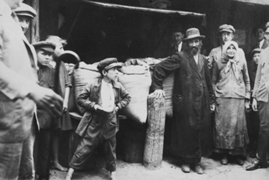 A Jewish family poses in front of their grains stall in the Drohobycz marketplace c. 1921(United States Holocaust Memorial Museum, courtesy of Paul (Leopold) Lustig)