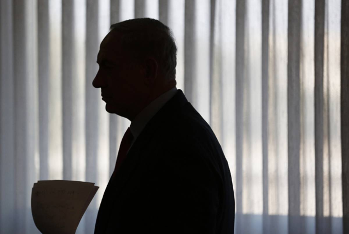 Israel's Prime Minister Benjamin Netanyahu is silhouetted as he arrives to deliver a statement to the media at the Knesset, on July 22, 2013 in Jerusalem, Israel.(Baz Ratner-Pool/Getty Images)