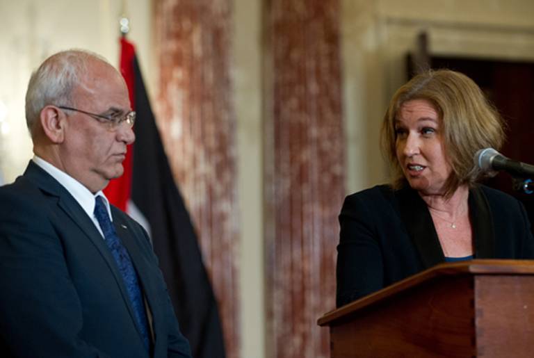 Israel's chief negotiator and Justice Minister Tzipi Livni (R) turns to chief Palestinian negotiator Saeb Erakat (L) as she speaks to the press with US Secretary of State John Kerry at the State Department in Washington,DC on July 30, 2013. (NICHOLAS KAMM/AFP/Getty Images)