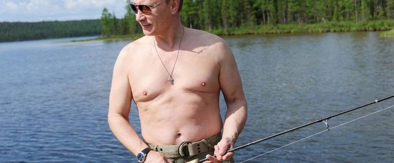 This picture made available on July 26, 2013 shows Russian President Vladimir Putin fishing in the Tyva region on July 20, 2013 during his vacation. 