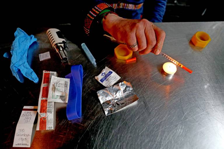 Geoffrey Bordas, 37, of Ontario, a fentanyl addict who also works at the Overdose Prevention Society (OPS), prepares an injection of fentanyl to be given to himself at OPS in the Downtown Eastside (DTES) neighborhood of Vancouver, British Columbia.