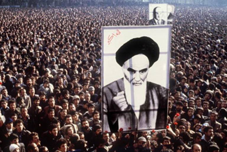 Protesters hold a poster of Ayatollah Ruhollah Khomeini during a demonstration in Tehran against the shah, January 1979.(AFP/Getty Images)