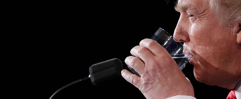 Republican presidential nominee Donald Trump takes a drink of water during the third U.S. presidential debate  in Las Vegas, Nevada, October 19, 2016. 