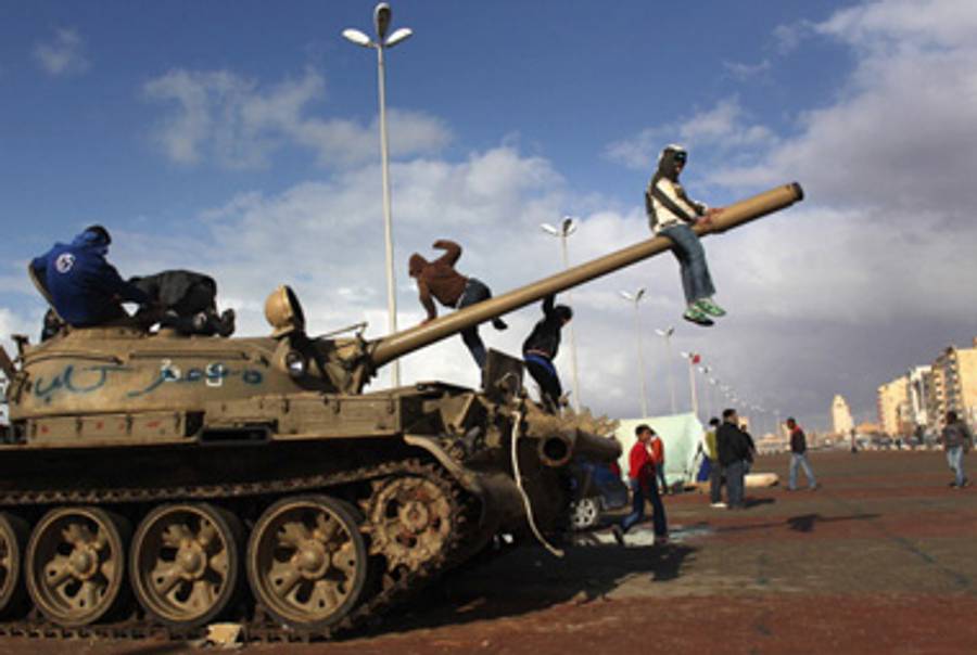 Children climbing on an army tank during a protest last week in Benghazi, Libya.(John Moore/Getty Images)