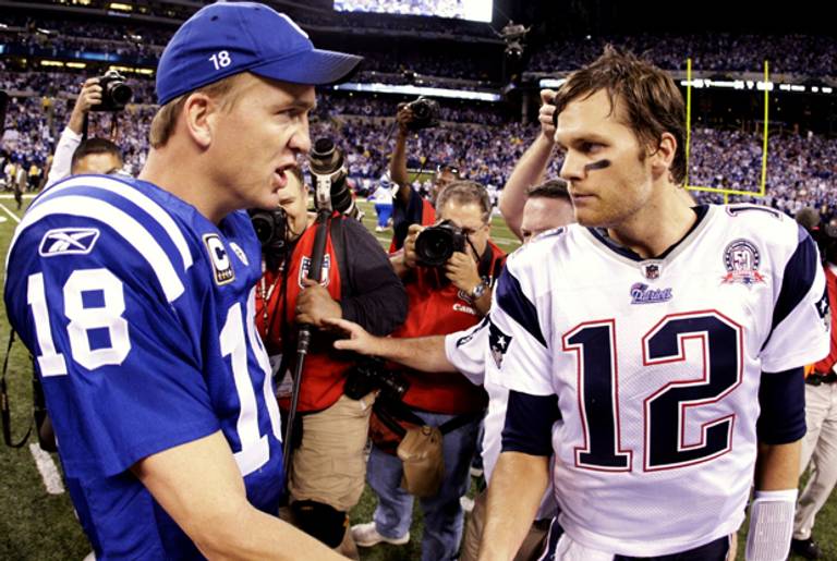 Quarterback Peyton Manning of the Indianapolis Colts greets Tom Brady of the New England Patriots on Nov. 7, 2005. (Jamie Squire/Getty Images)