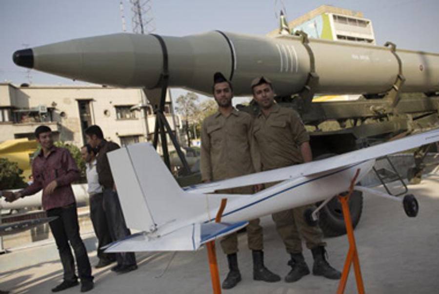 Iranian Revolutionary Guardsmen with a differnt type of long-range missile.(Behrouz Mehri/AFP/Getty Images)