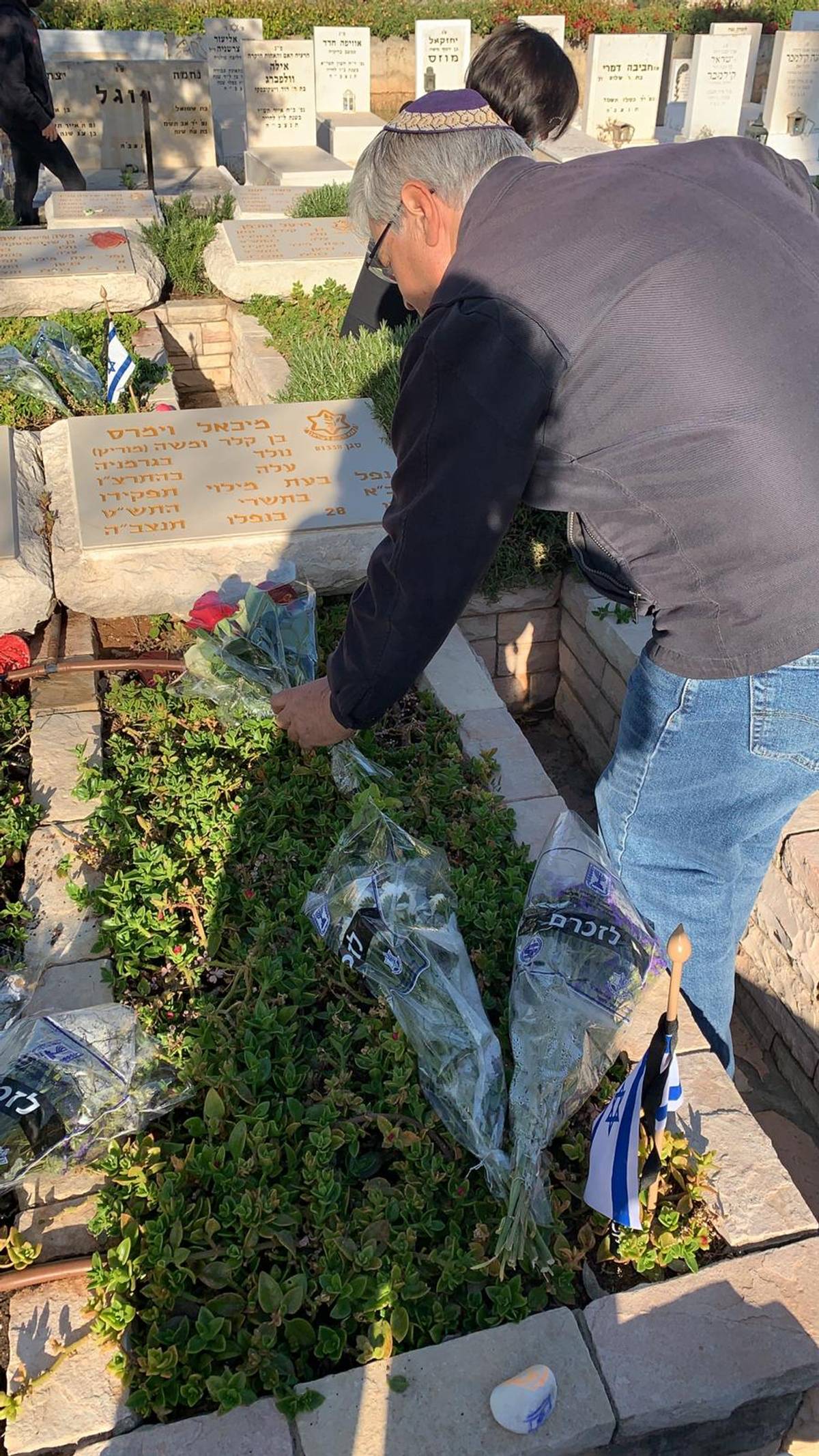 Michael Tsur visits his uncle's gravesite, 2021