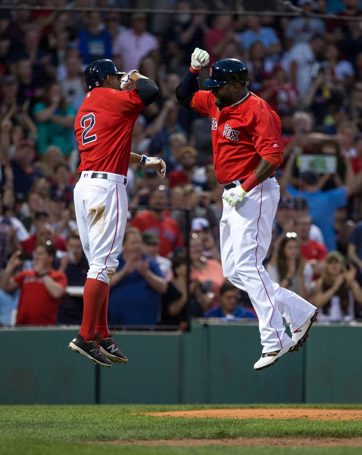 David Ortiz celebrates with Xander Bogaerts after he hit a two-run home run against the Seattle Mariners at Fenway Park, June 17, 2016. (Rich Gagnon/Getty Images)