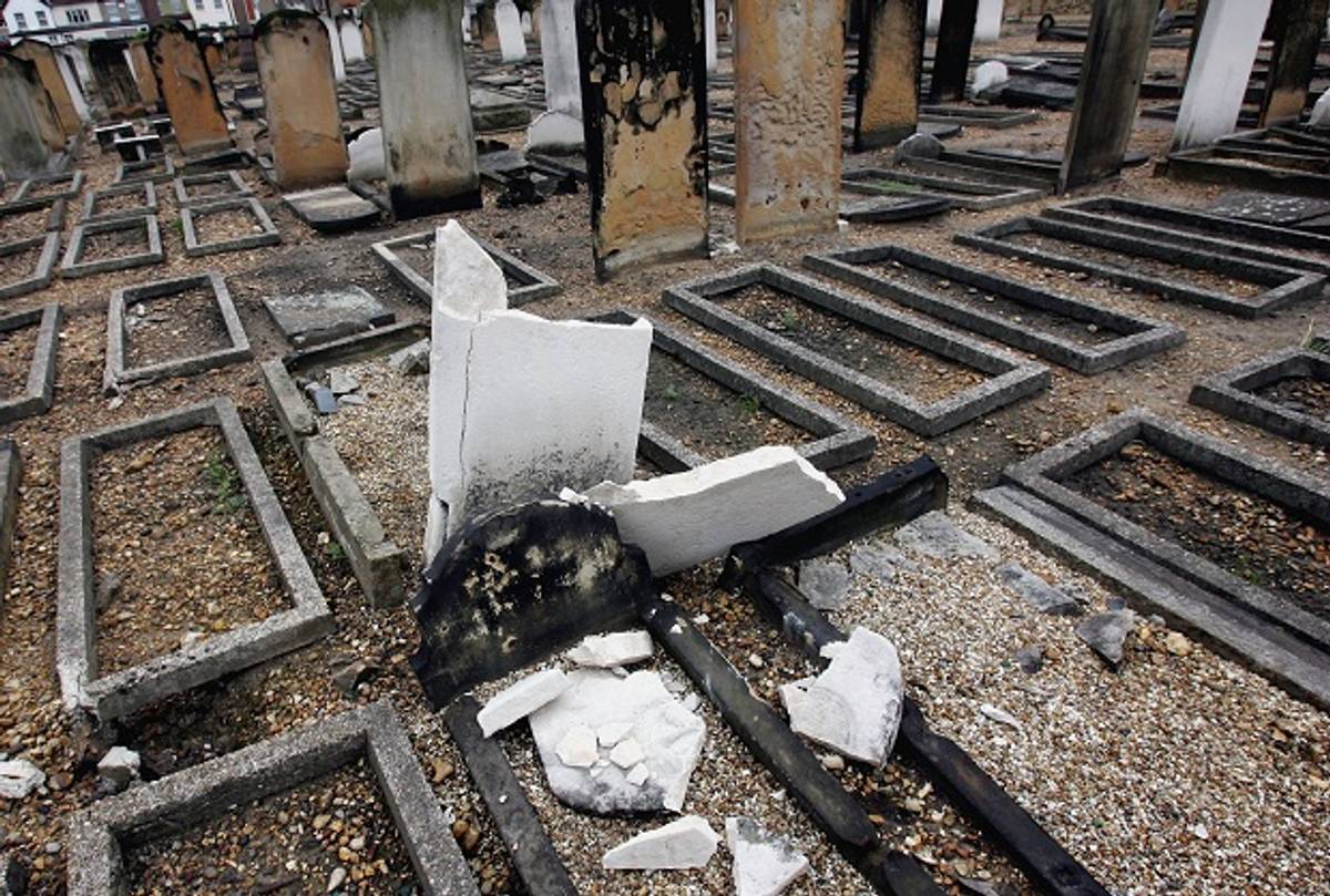 Gravestones lay desecrated in Eastham Jewish cemetery, June 16, 2005, in London, England. (Getty Images)