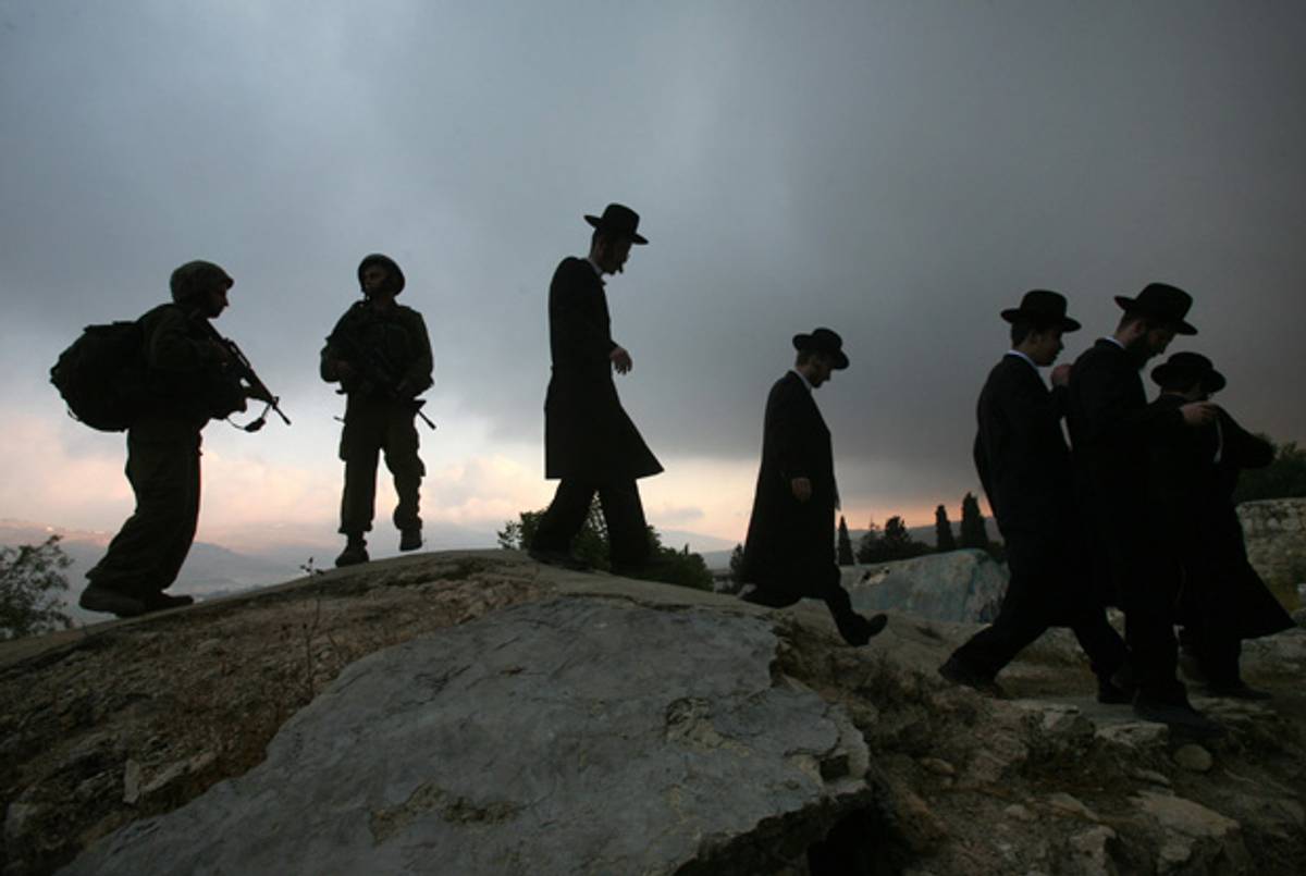 Israeli soldiers and ultra-Orthodox Jews in the northern West Bank, 2007(Menahem Kahana/AFP/Getty Images)