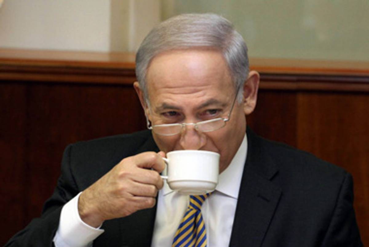 Prime Minister Netanyahu enjoys his coffee yesterday.(Gali Tibbon - pool/Getty Images)