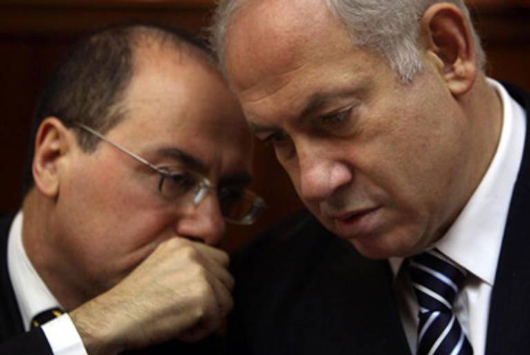 Shalom (L) huddles with Prime Minister Netanyahu last year.(David Silverman/AFP/Getty Images)