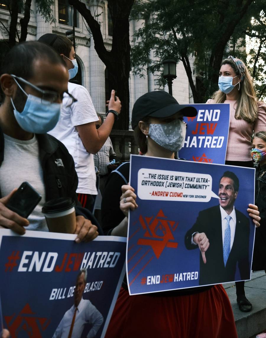 Protesters rally in Manhattan against the closing of some schools and businesses in Jewish neighborhoods in Brooklyn and Queens due to a spike in COVID-19 cases in these areas, on Oct. 15, 2020