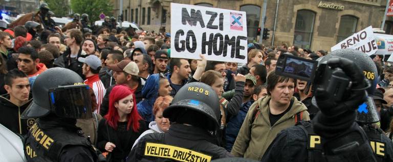 Policemen face counter-demonstrators during a protest against a Neo-Nazi march in Brno, Czech Republic, May 1, 2015. 
