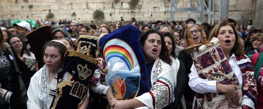 Israeli members of the liberal Jewish religious group Women of the Wall, carry a Torah scroll after prayers in the women's section of the Western Wall, in the Old city of Jerusalem on November 2, 2016, during a protest by the group demanding equal prayer rights at the site. 